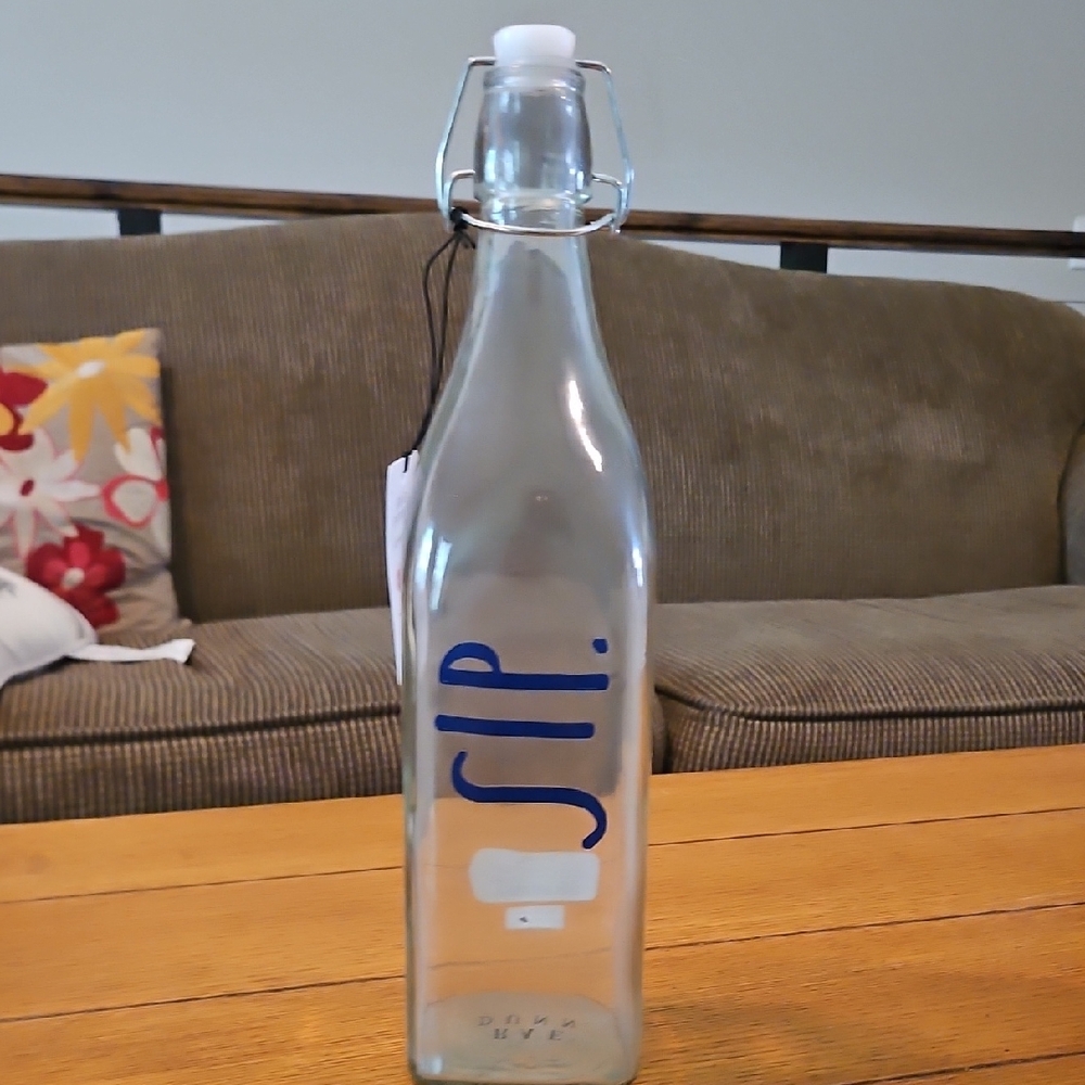 Rae Dunn Clear Glass Bottle with Blue 'SIP' Design